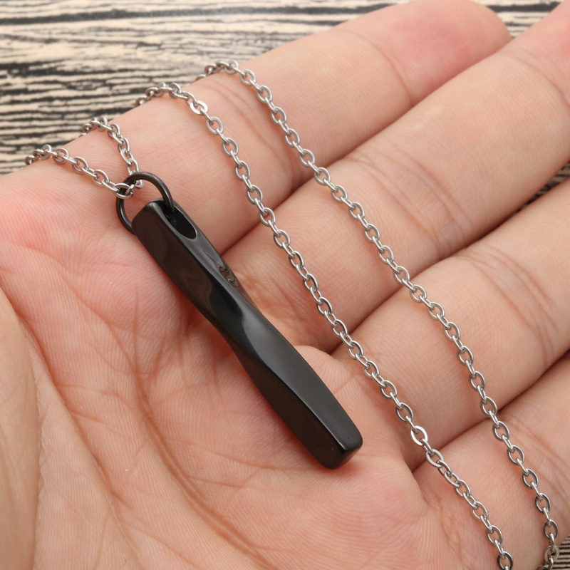 Black pendant with cross chain