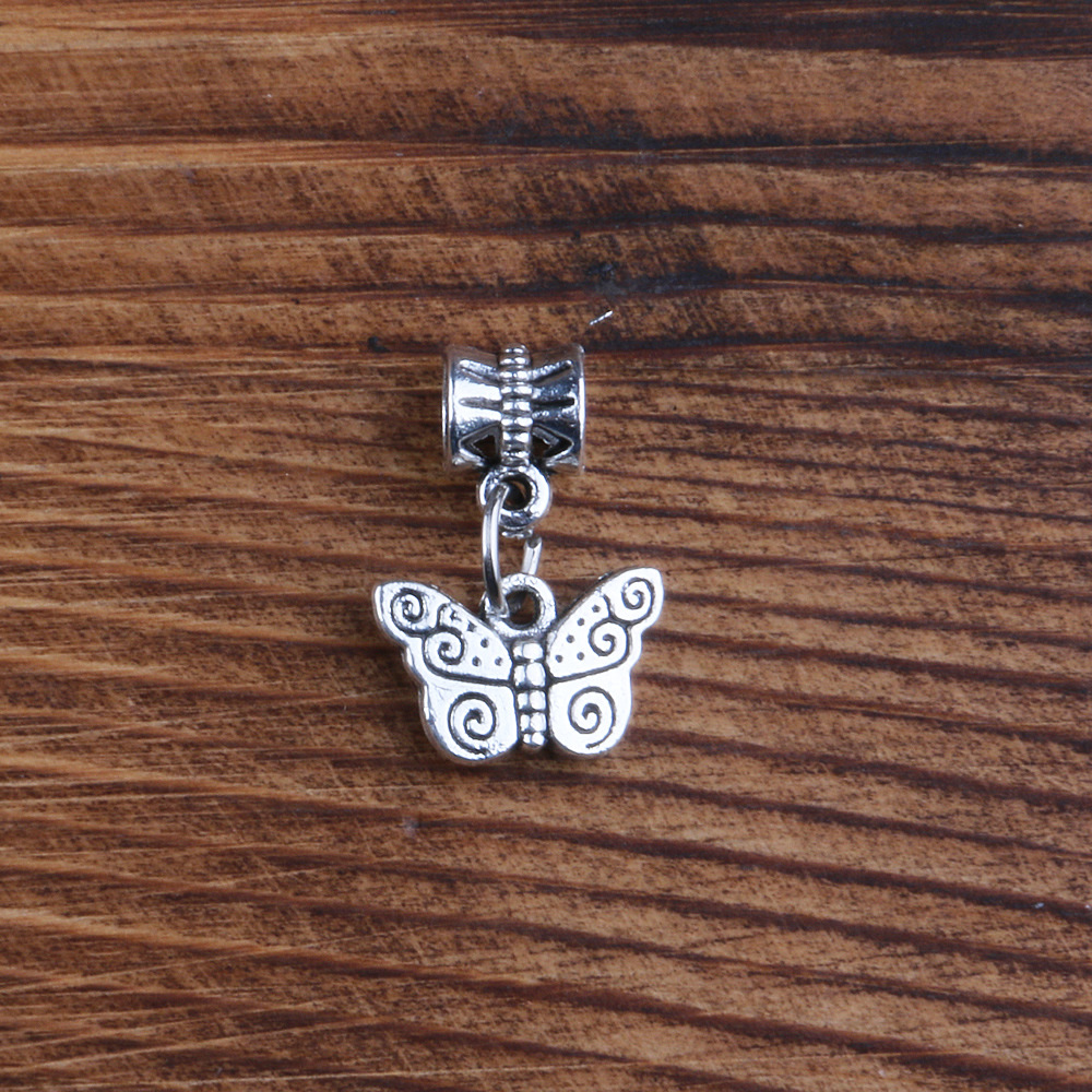 A butterfly pendant with a ring