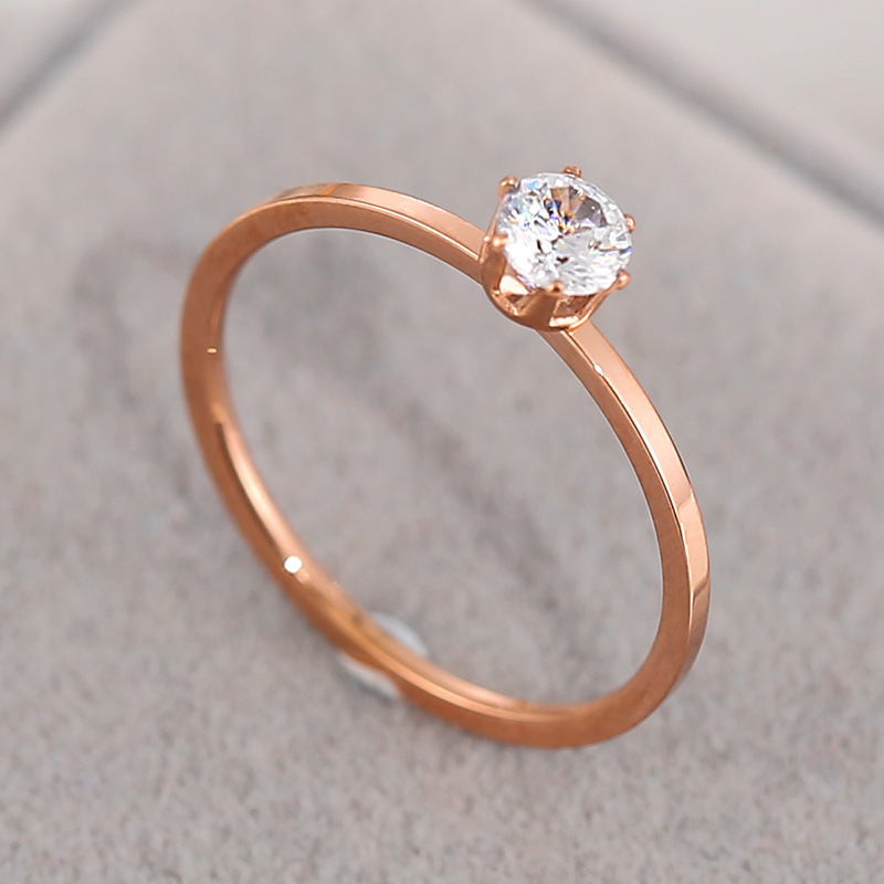 Six-claw, single diamond, rose gold eight