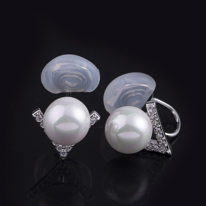 Clip-on earring with silicone spacer. White pearl