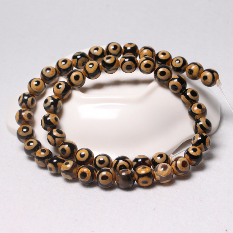 2:Yellow and black three-eyed beads