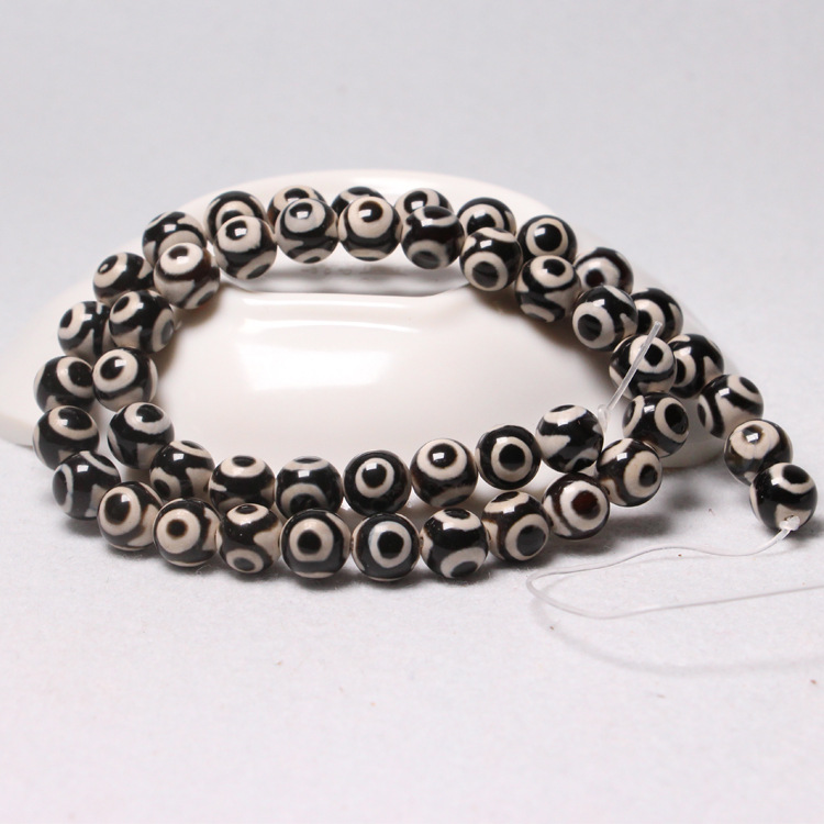 3:Black and white three-eyed beads