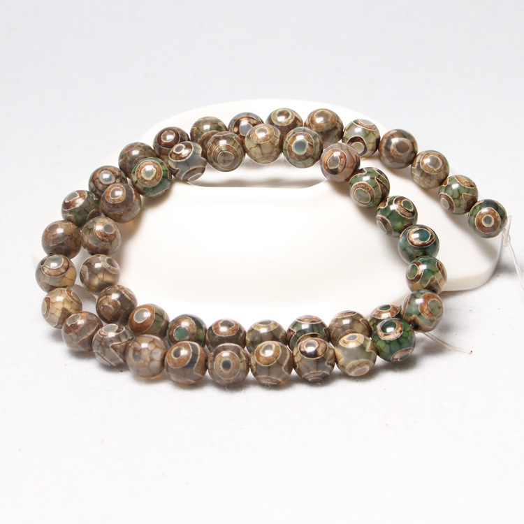 4:Khaki green beads with three eyes