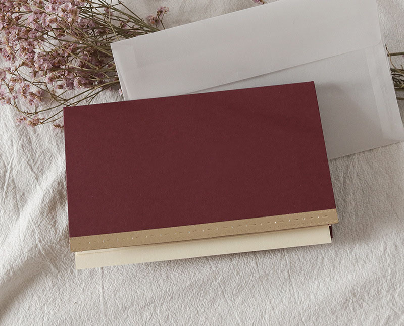 Dark red blank greeting card + envelope + handwrit