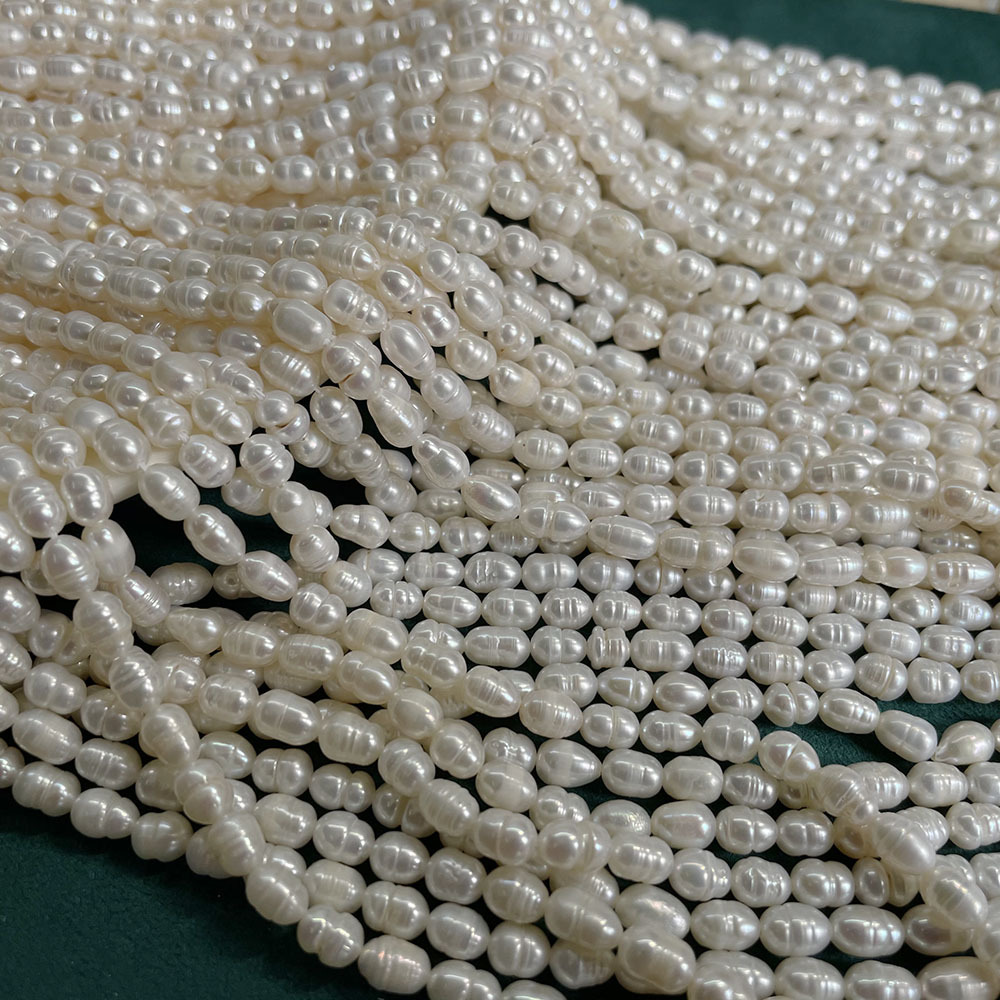 White threaded beads, about 53 pieces, 4-5mm