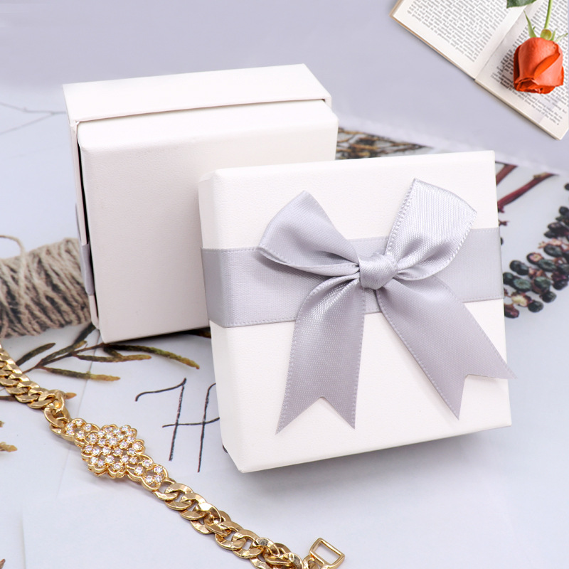 White box grey bow