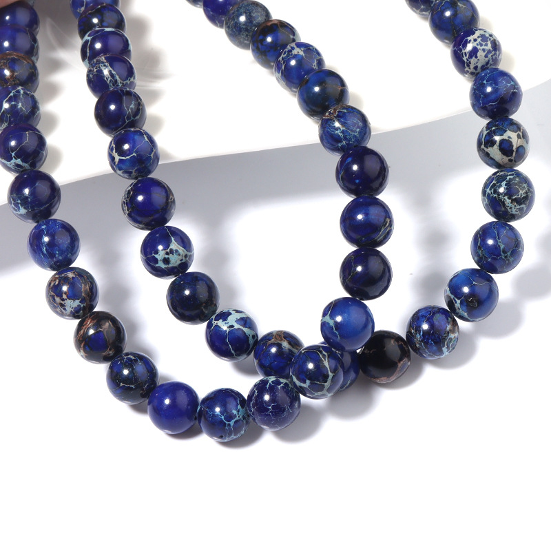 The dark blue Imperial stone is 6mm in diameter an