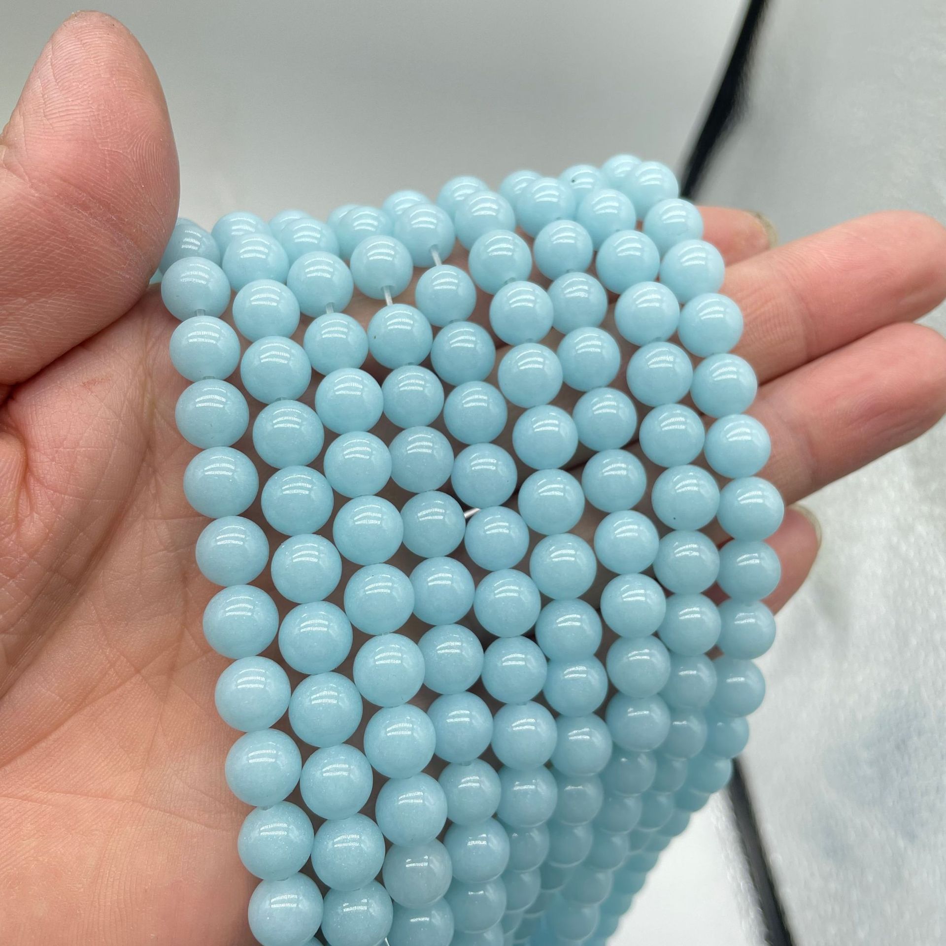 Light blue luminous stone 6mm (about 90 pieces)