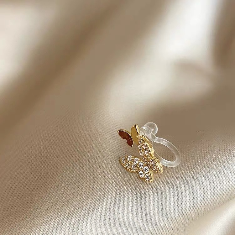 7:7# One golden double butterfly ear clip