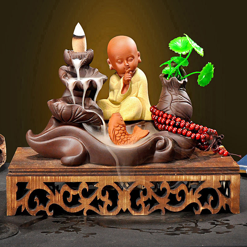 4:Hollow wooden base   big leaf lotus pond   meditating yellow little monk