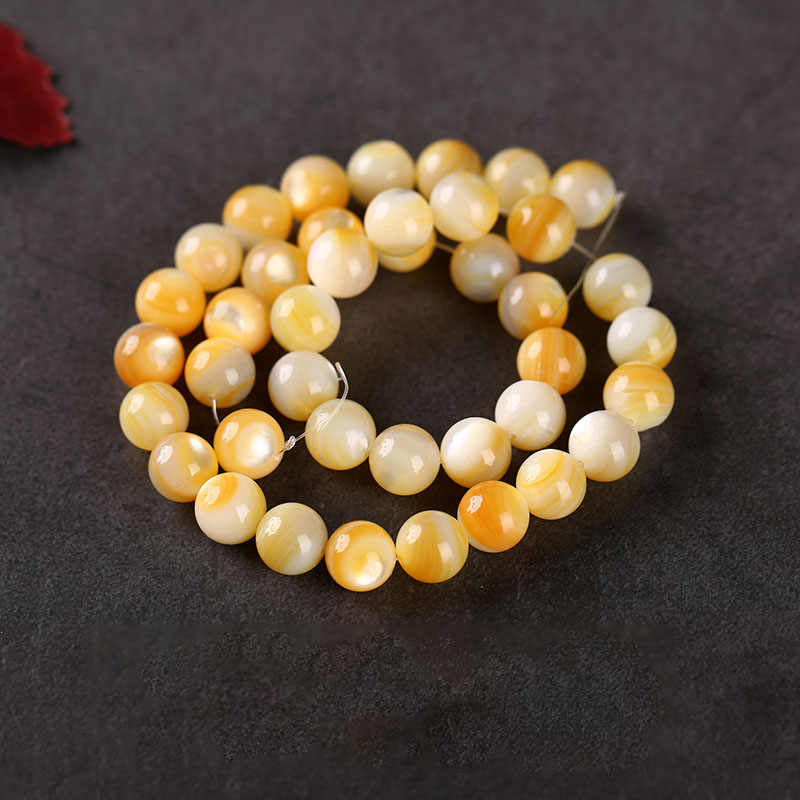 Yellow seashells 10mm, 40pcs/bar