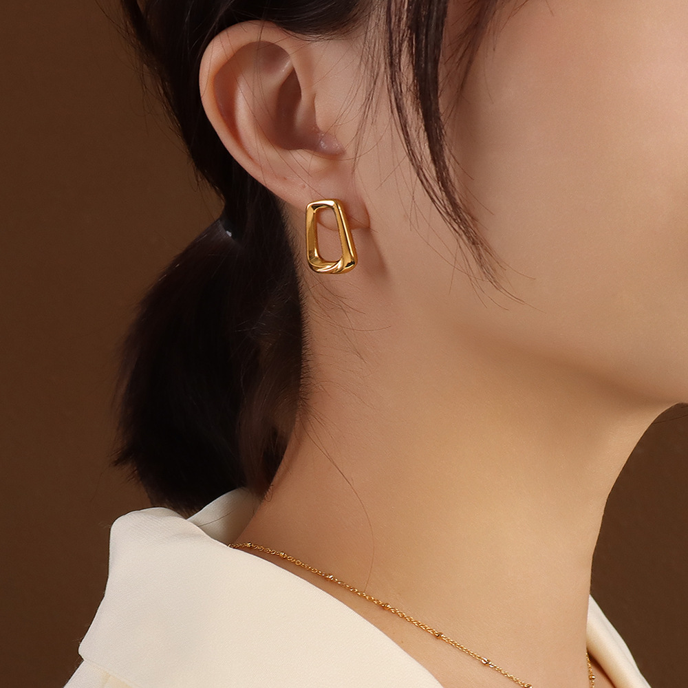 A pair of gold earrings