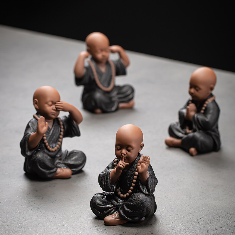 Four little black monks set