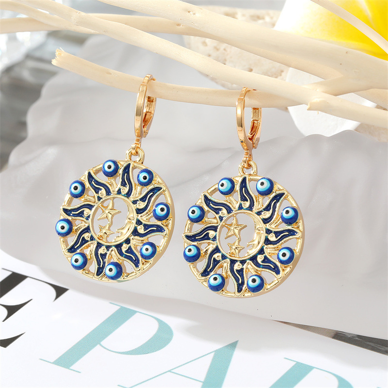 Sun blue eye earrings