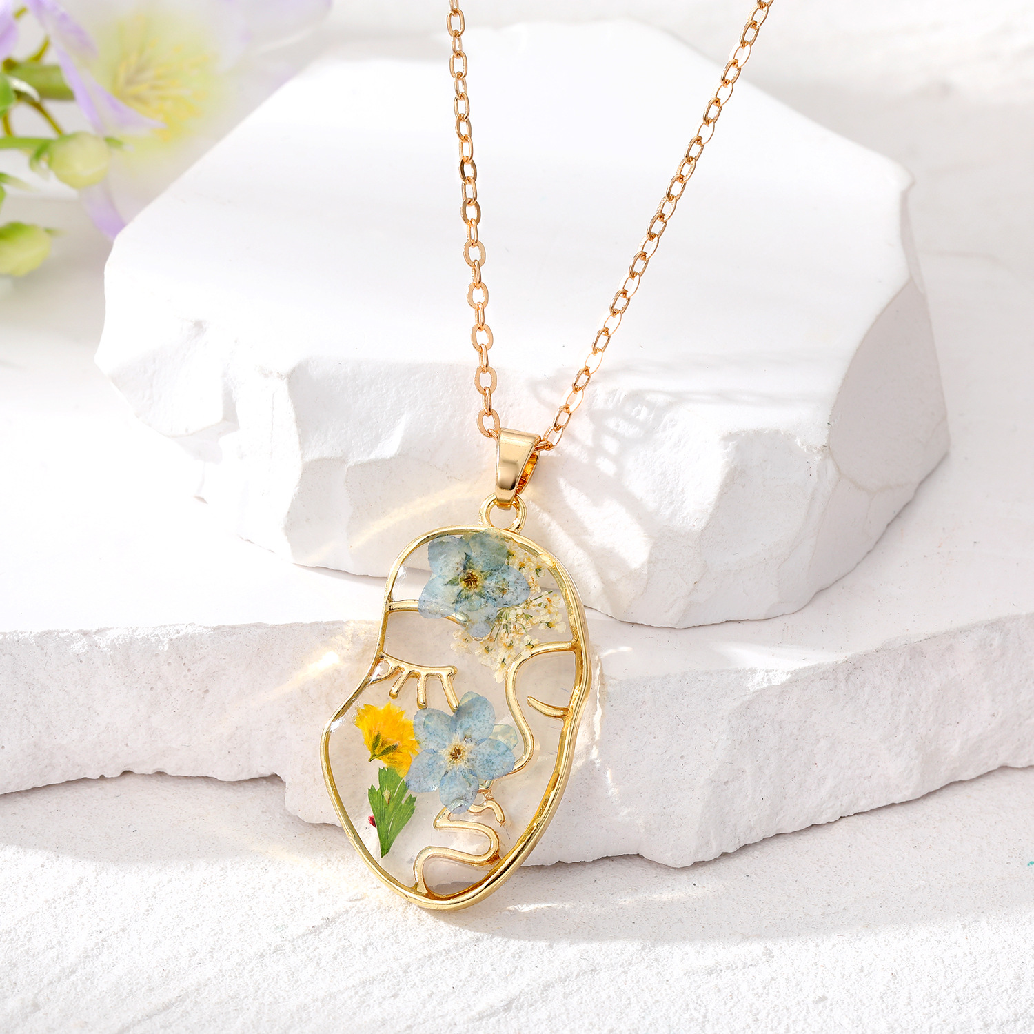 Golden face light blue flower necklace