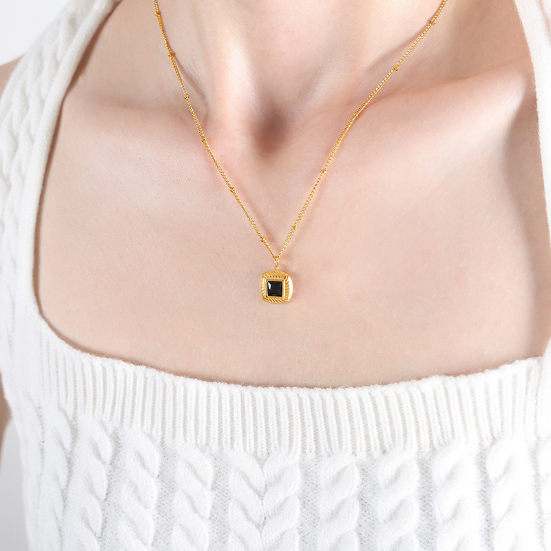 Gold black glass stone necklace