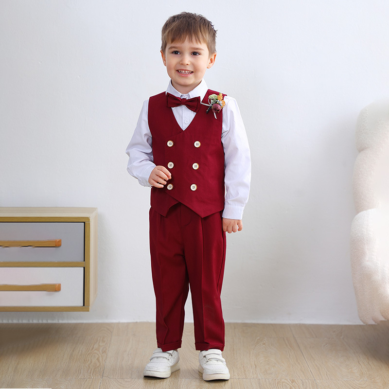 Red vest , pants , white shirt with bow tie corsage