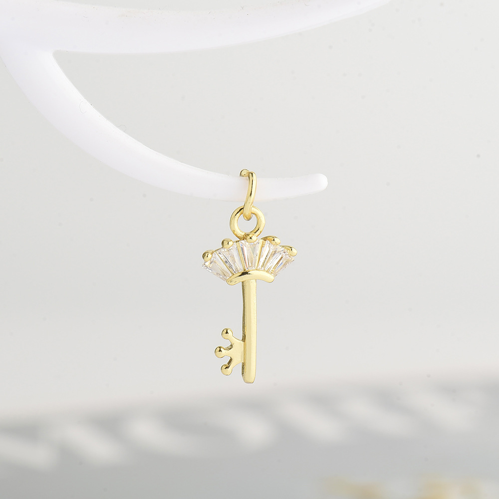 Gold key pendant