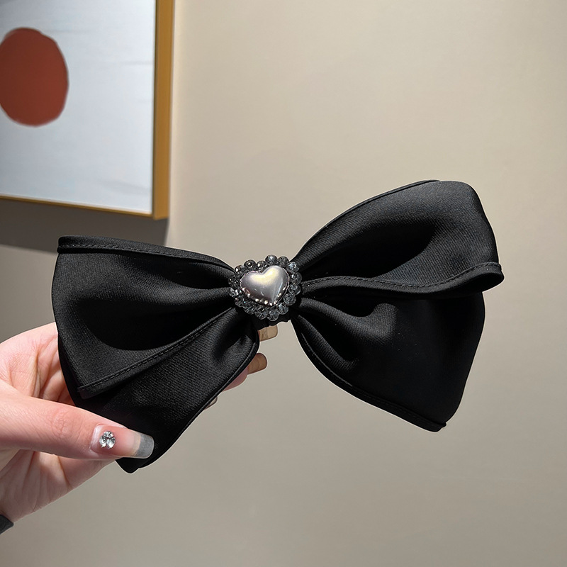 Black love bow spring clip