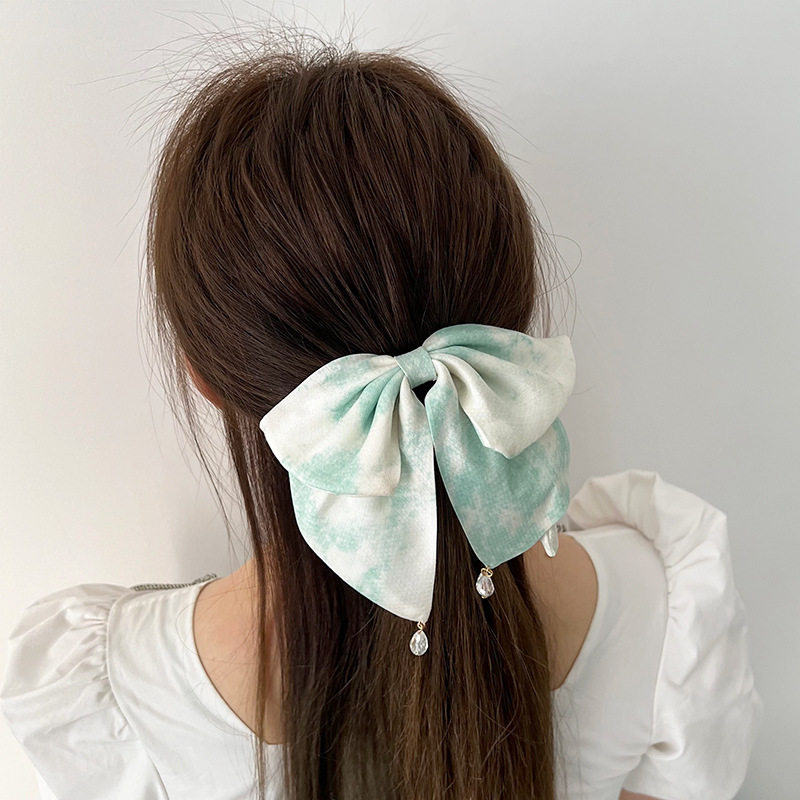 Blue tie dye bow clip