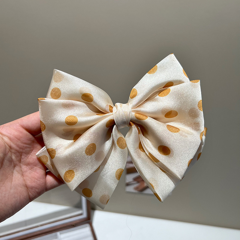 Yellow polka-dot triple bow hair clip