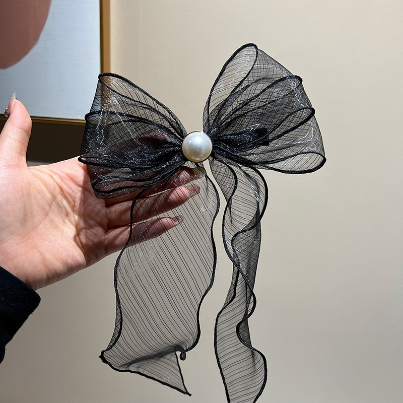 Black bow streamer hair clip