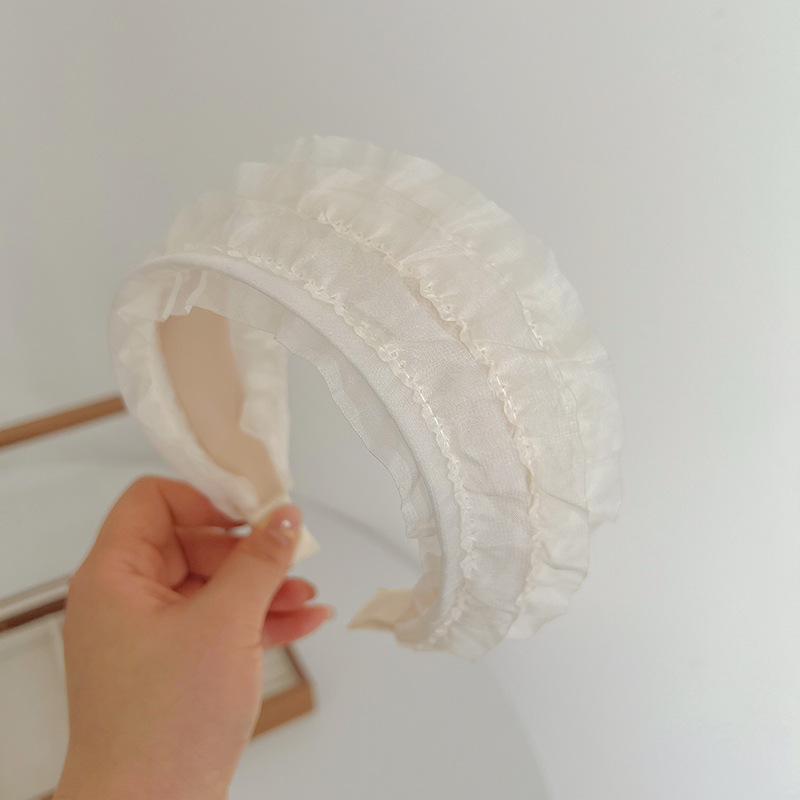 Beige mesh headband with wide edge