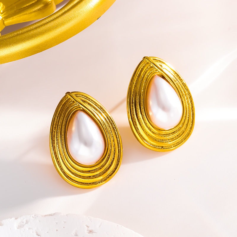 Gold stud earrings