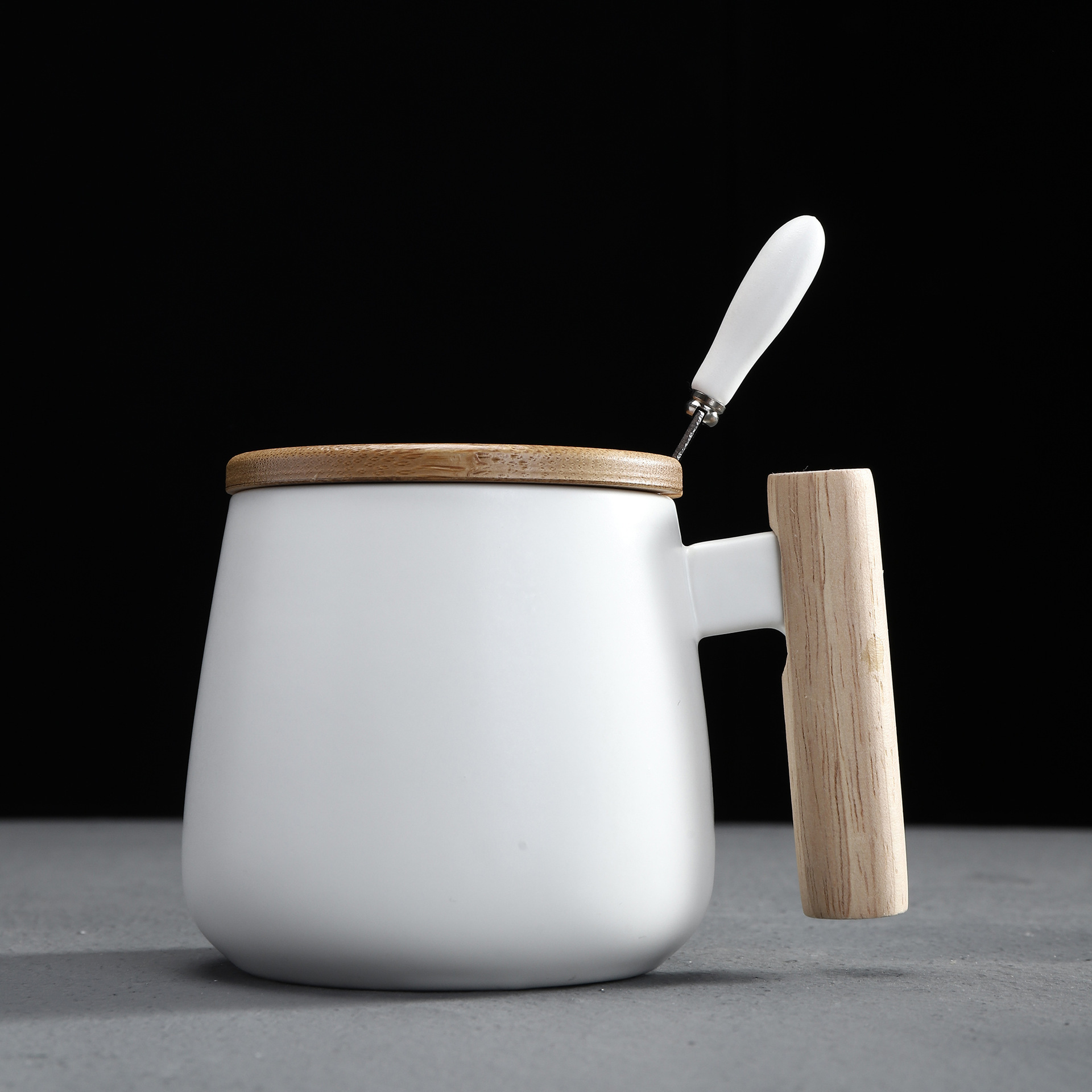 white mug with lid and spoon