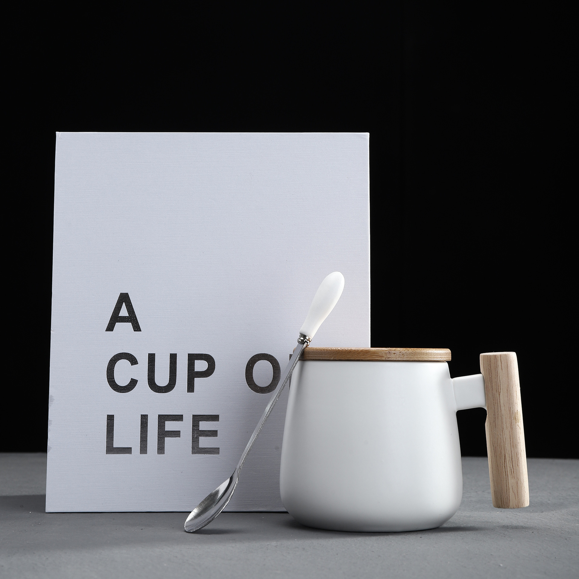 white mug with lid, spoon and gift box