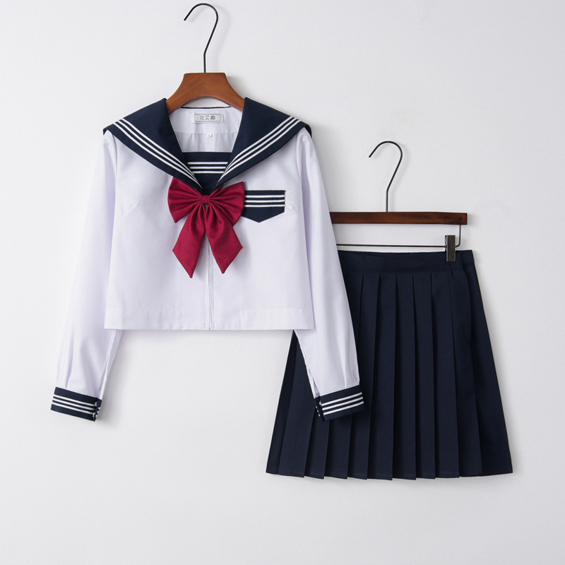 Long sleeve top   navy blue skirt   goldfish knot