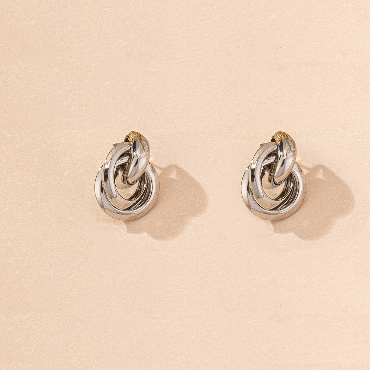 White and gold round stud earrings