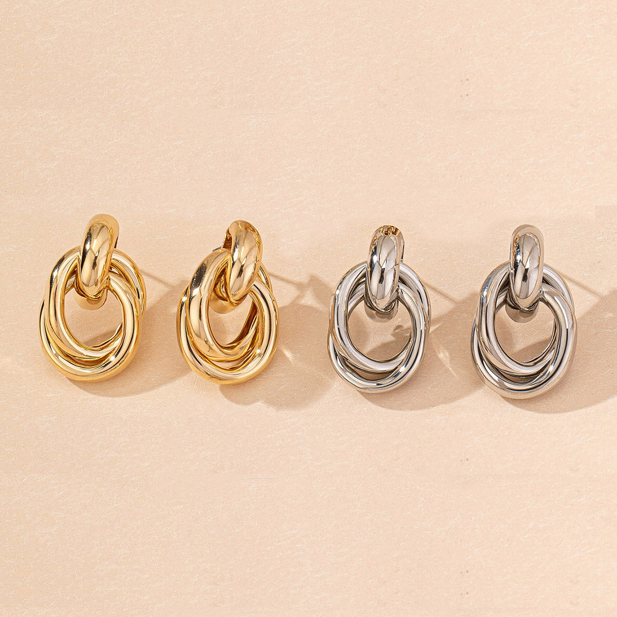 6:Two sets of gold and silver oval earrings