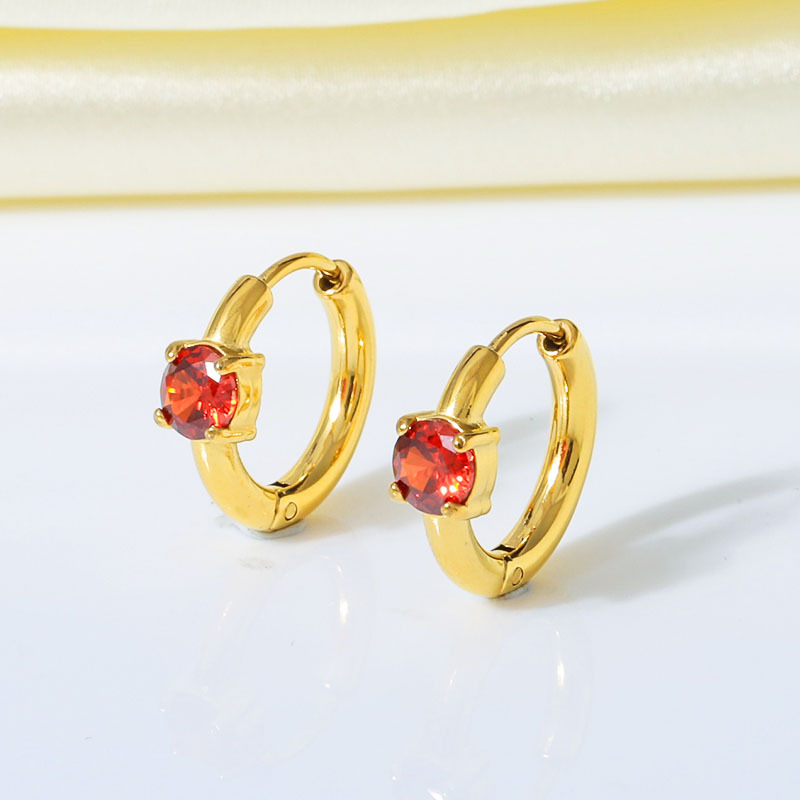 Gold inlaid with red zircon