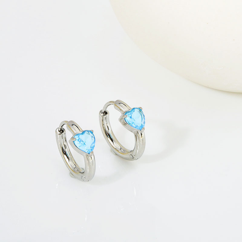 Set with light blue diamonds. - Silver stud earrin