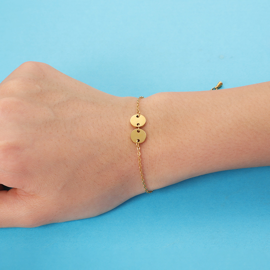 4:Gold bracelet (two discs)