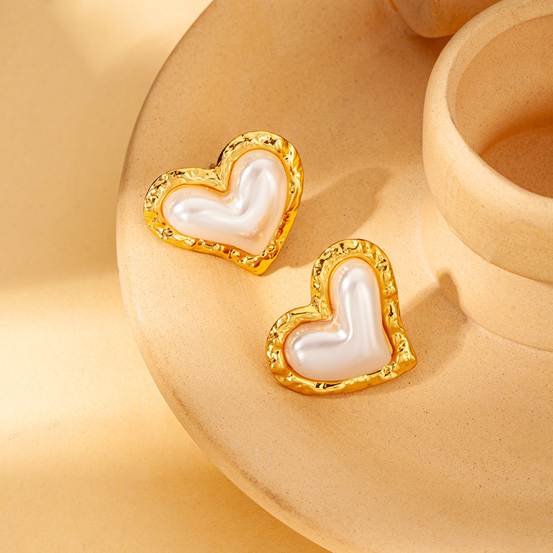 White shell stud earrings with gold border