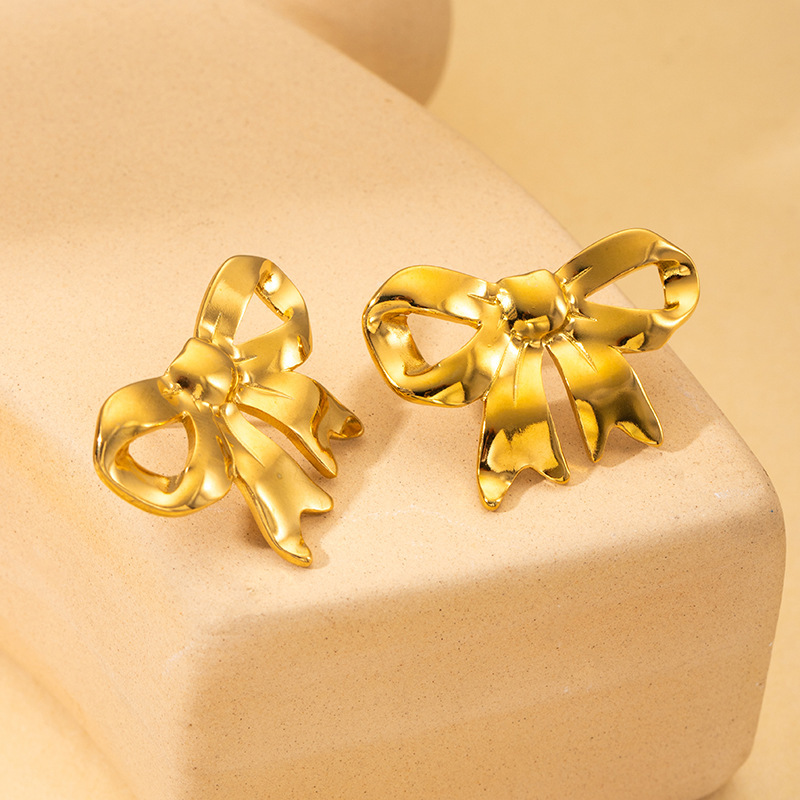 Gold bow stud earrings