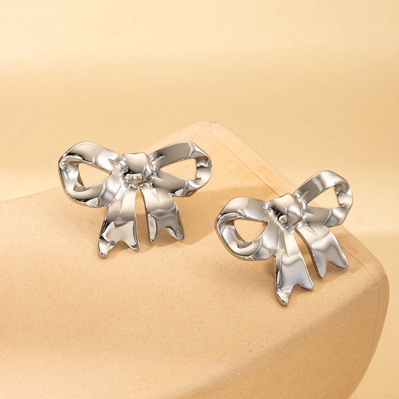 Silver bow stud earrings