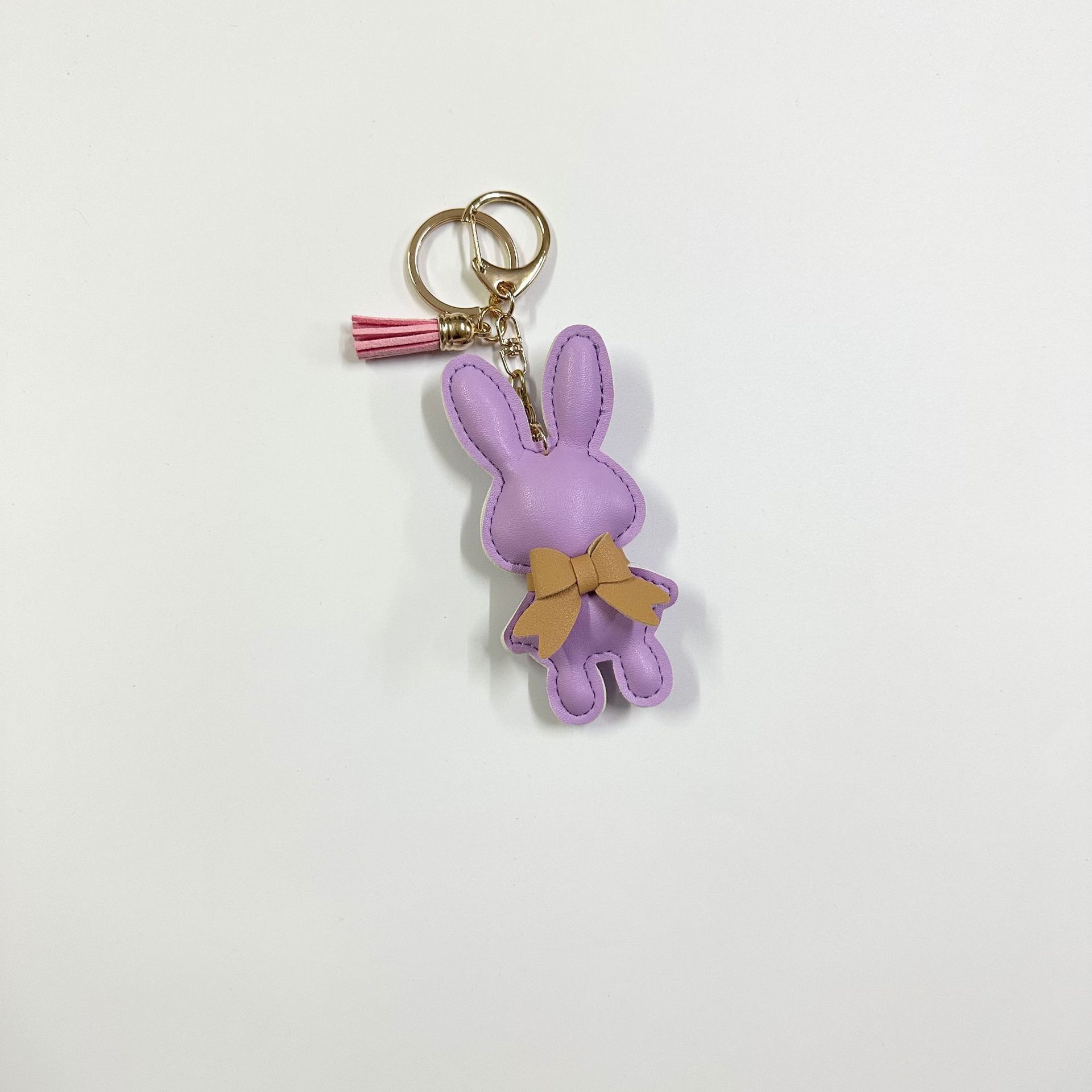 11:Purple Rabbit with Button Tassel