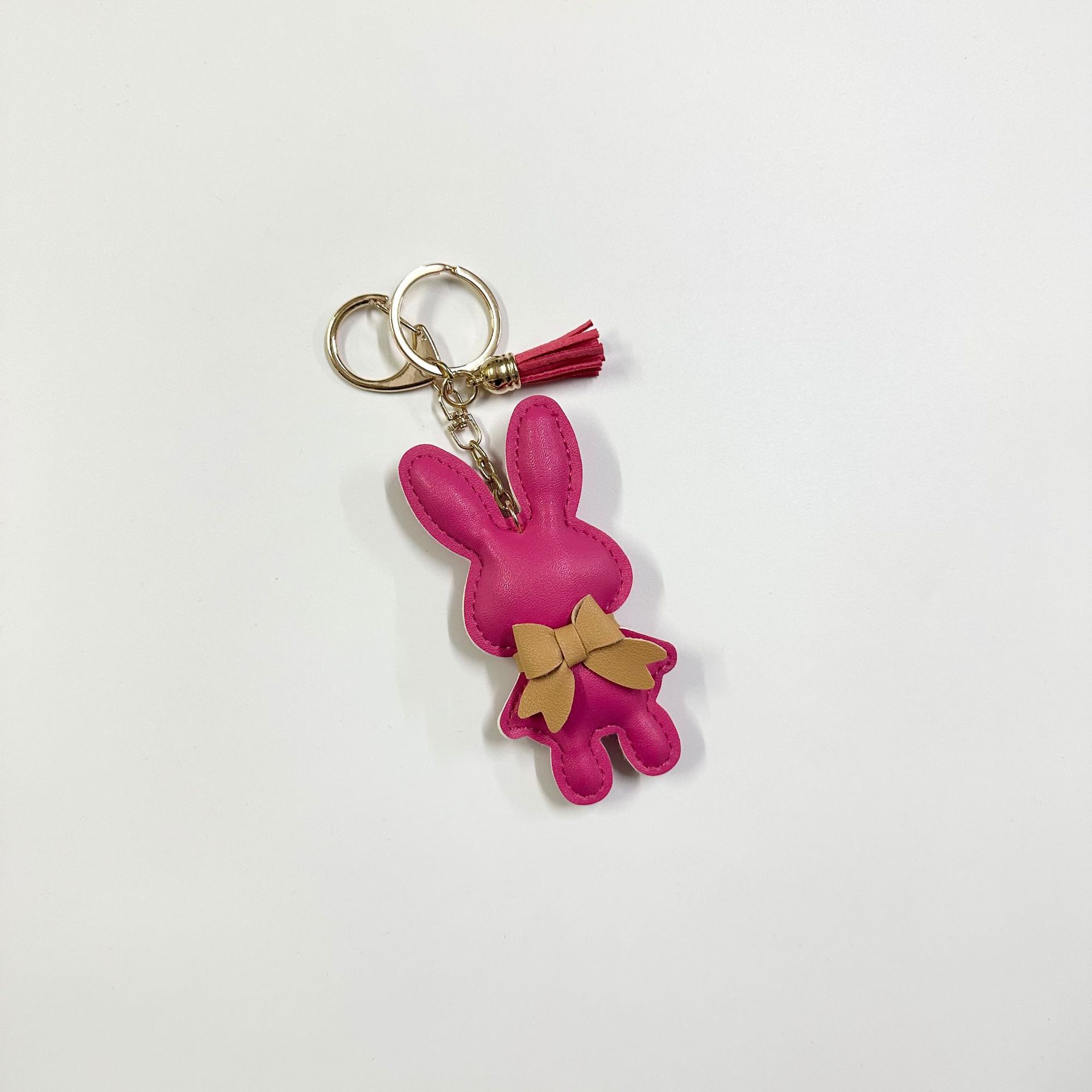 13:Rose red rabbit with button tassel