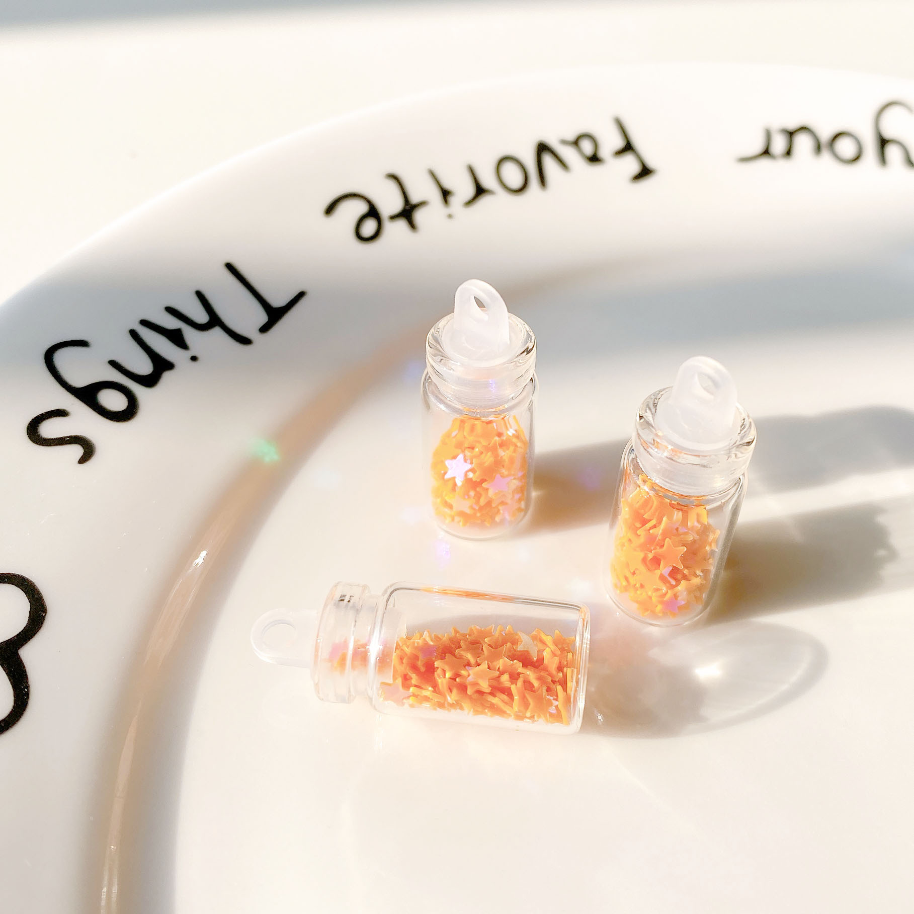 4:Orange five-pointed star sequin glass bottle pendant