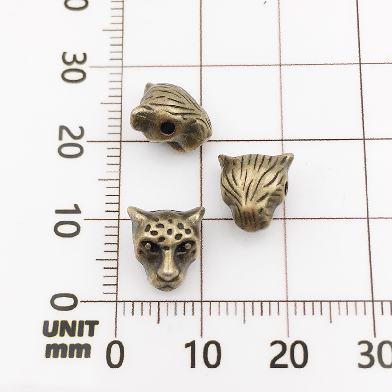 9:10120-antique  Bronze Leopard Head-9x10-1.5mm