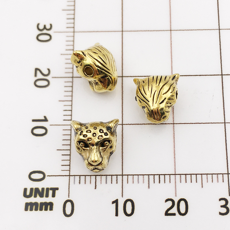 10:10121-antique gold leopard head-9x10-1.5mm