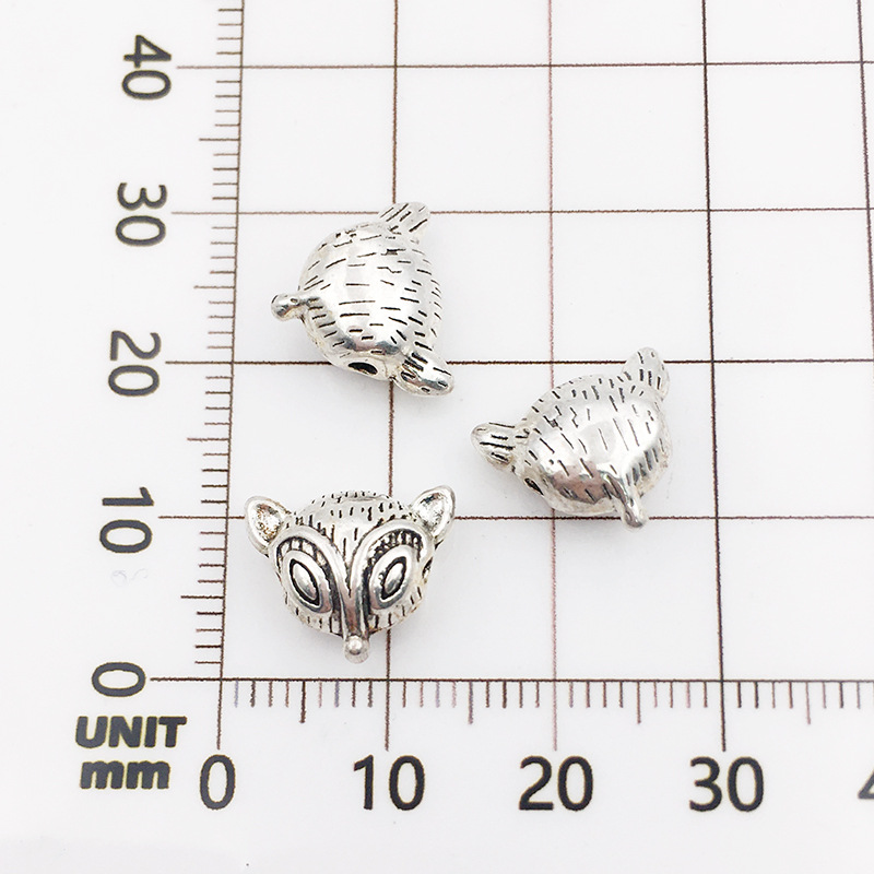 17:10131-antique silver fox head 10x12-1.5mm