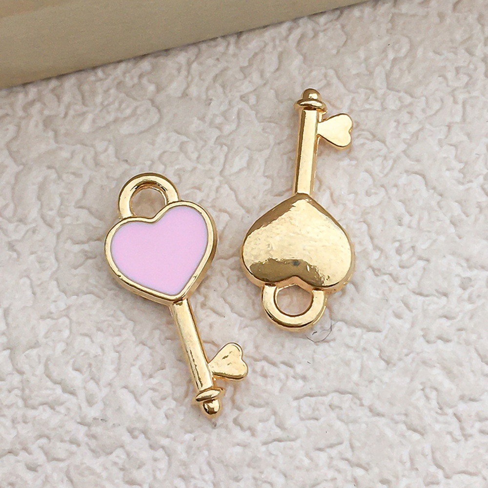 1 pink peach heart-shaped key 7×16mm-0.5g-10989