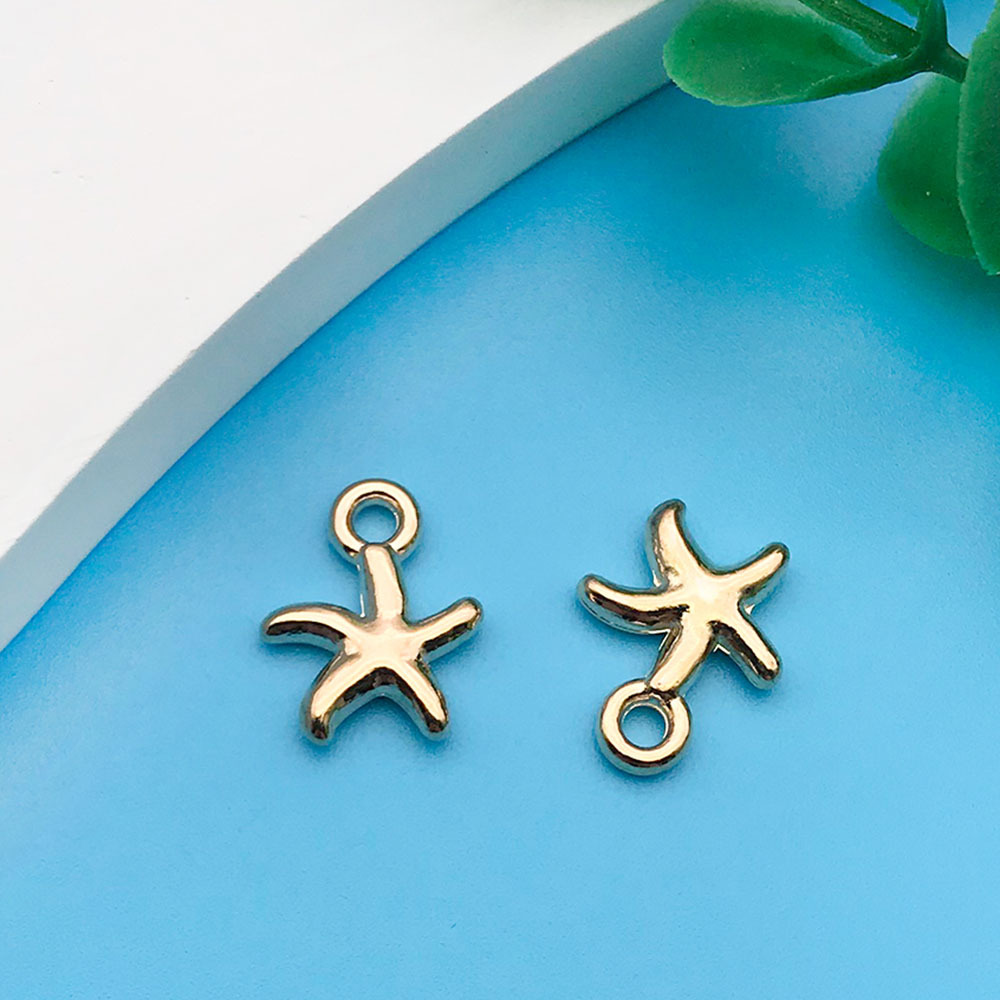 1 kc Gold Ocean Starfish 10x13mm-11594-0.6g