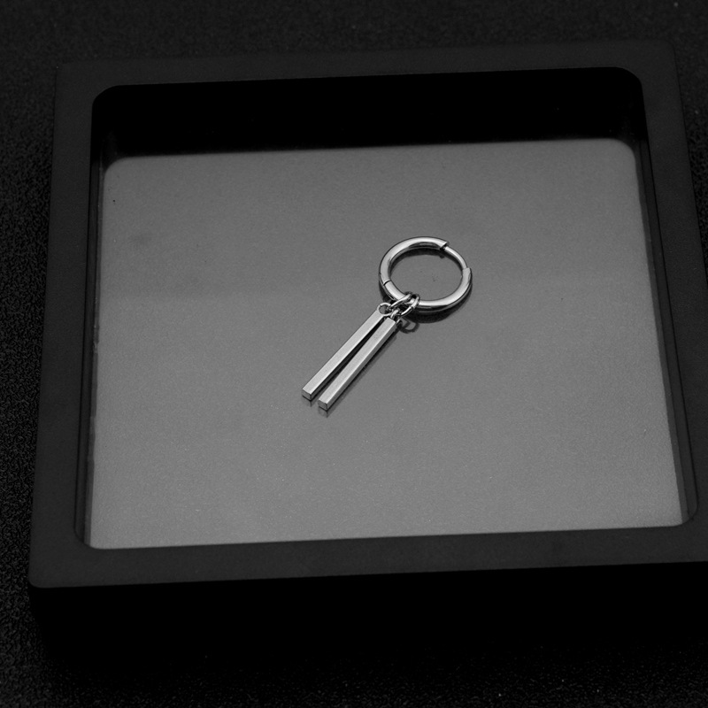 1:has an ear hole and an ear ring in steel.