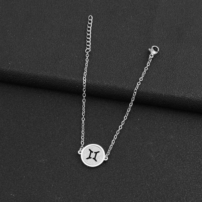 11:A steel-colored Gemini bracelet