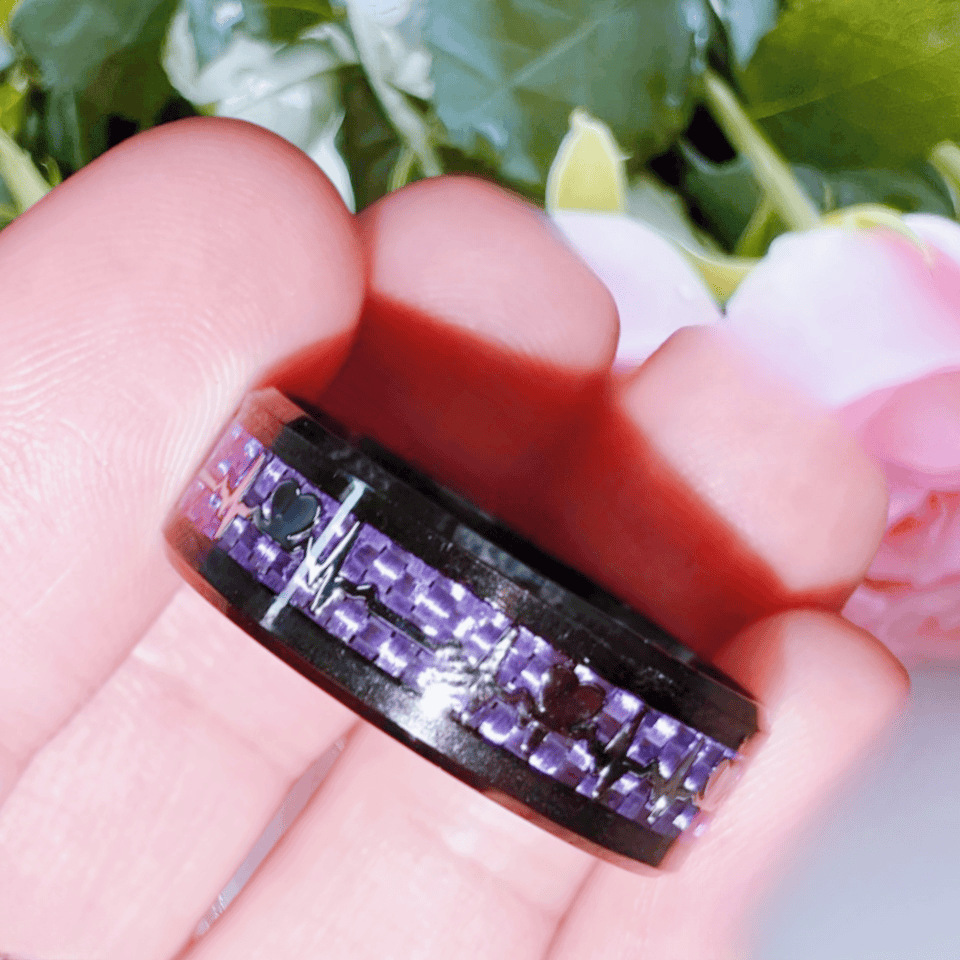 Purple carbon fiber electrocardiogram on black bac